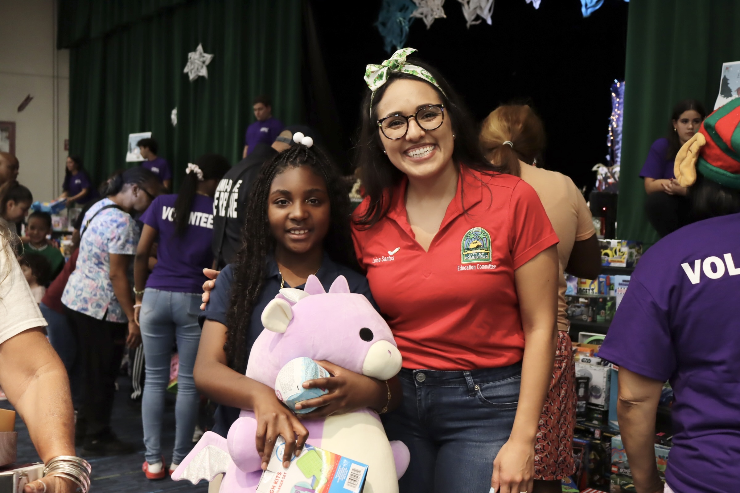 Luisa with student and gift